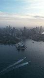Aerial video of Sydney City and Sydney Harbour, Australia, at sunset