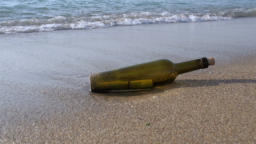 Bottle with a message on the sea beach. | Shutterstock HD Video #34520644