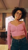Vertical Screen: Beautiful Young Female Record a Dancing Routine on a Smartphone Video for Social Media. Stylish Black Girl in Glasses Streaming Her Choreography on Internet from Home.