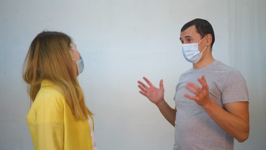 People wearing medical masks are talking. Elbow-fist greeting is new and safe way of greeting to avoid spread of coronavirus. People avoid shaking hands to avoid infection. Salutation with elbow, fist Royalty-Free Stock Footage #3452226049