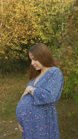 Beautiful pregnant woman having walk in the park Royalty-Free Stock Footage #3452265773