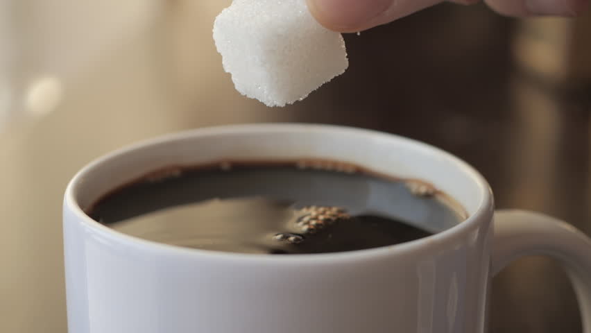 Slow Motion Hand Dropping Sugar Cube Into Black Coffee. Sugar Falling Down Into Coffee Cup. Coffee Caffeine Addiction Junk Food. Concept of Unhealthy Eating, Diabetes, Obesity, Heart Disease.  Royalty-Free Stock Footage #3452317833