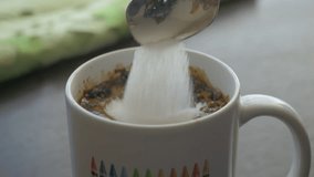 Slow Motion Putting Sugar in to Black Coffee. Sugar Falling Down Into Coffee Cup. Coffee Caffeine Addiction Junk Food. Concept of Unhealthy Eating, Diabetes, Obesity, Heart Disease.  - Powered by Shutterstock - Get 15% off with code: PIKWIZARD15
