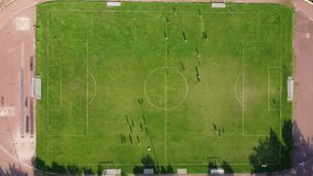 football field with players top view. drone video