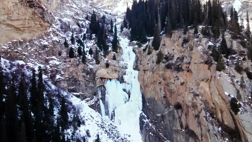 Ice climbing at frozen waterfall.