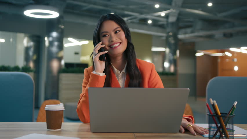 Zoom out portrait asian elegant professional business woman in suit using smartphone in modern office. Collage of diverse age, gender business people. Company managers in corporate office, work day 4K Royalty-Free Stock Footage #3452534725