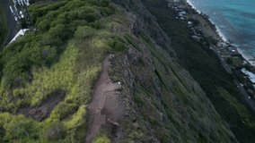 Aerial video of a coastline in Hawaii from a high perspective.