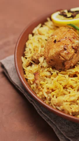 Chicken Biryani in Clay Bowl on Brown Background, Panning Camera Shot, Vertical Video Royalty-Free Stock Footage #3452752509