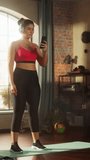 Vertical Screen. Beautiful Athletic Plus Size Body Positive Sports Woman, Does Aerobic Exercises Workout, Shadow Boxing at Home. Female Training Listening Music, Podcast Wearing Headphones. Wide Shot