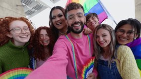 Young group of LGBT people enjoying gay pride parade festival outside. Lesbian and gay friends having fun together celebrating LGBTQI festival event together in city street. - Powered by Shutterstock - Get 15% off with code: PIKWIZARD15