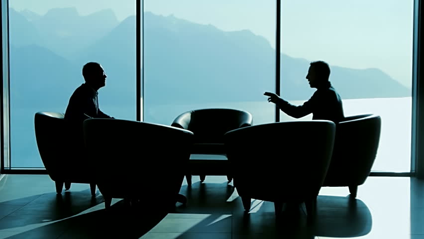 Two Professionals Discuss Ideas in the Office