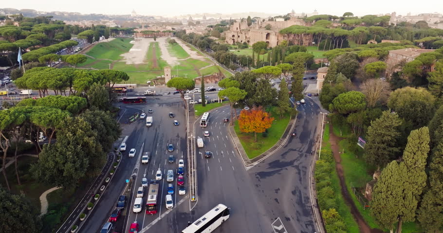 Aerial view of the urban landscape of Rome, Italy. Movement in traffic jams in the capital in a beautiful landscape of the city with ancient architecture and parks, movement of cars and buses.