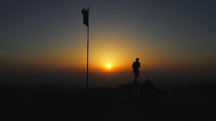 A cinematic image of the statue of Ataturk and the waving Turkish flag at the position called Kocatepe, where Mustafa Kemal Ataturk launched the great offensive, at sunrise. Kocatepe, Afyon-Turkey