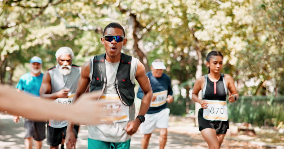 High five, marathon and running with race, competition and exercise for wellness, sports and endurance. People, athletes or group of runners in workout or training with fitness, support or motivation