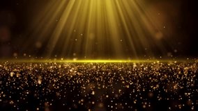 Light shining on gold dust particles Video