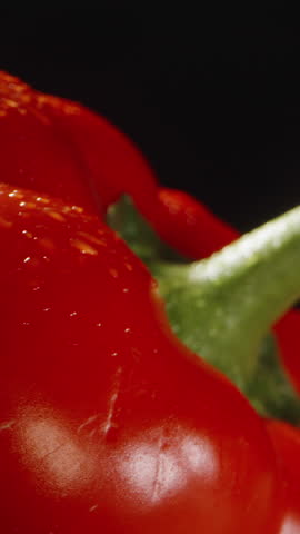 I'm cutting Red Bell peppers. the camera zooms in and shoots its seeds inside the pepper. Macro. Slider. Vertical video Social Media