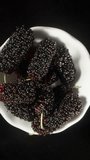view from above. I take Mulberry berries and bring them to the camera, macro. Accelerated shooting. Vertical video Social Media