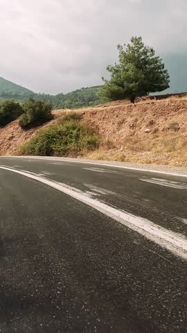 Navigate through mountain and forest on dangerous, road with sharp turns. First-person view of dangerous, road serpentine paths. Experience the thrill of dangerous, road driving