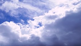 Seamless Loop Clouds, Towering Cumulus Cloud Billows Time Lapse. Time lapse clip of white fluffy clouds over blue sky, Changing cloud against moving clouds and blue sky time-lapse. Full HD.