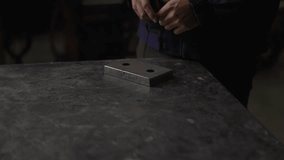 Unrecognisable person measuring metal piece. Precision concept.