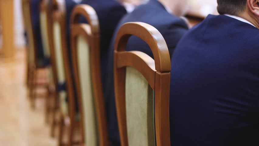 Group of men in business suits talking and discussing at conference, politicians and entrepreneurs debate, networking and negotiate, businessmen have dialog conversation on a forum, panel discussion