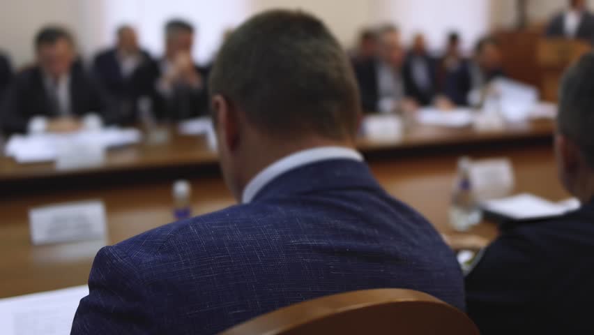 Group of men in business suits talking and discussing at conference, politicians and entrepreneurs debate, networking and negotiate, businessmen have dialog conversation on a forum, panel discussion