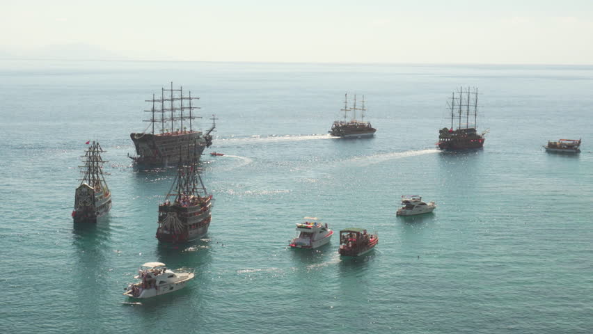Awesome aerial view of tourist ships and boats in the Mediterranean Sea by the coast of Alanya, Turkey. The ships are decorated as piratical. Alanya is a popular tourist destination in Turkey.
