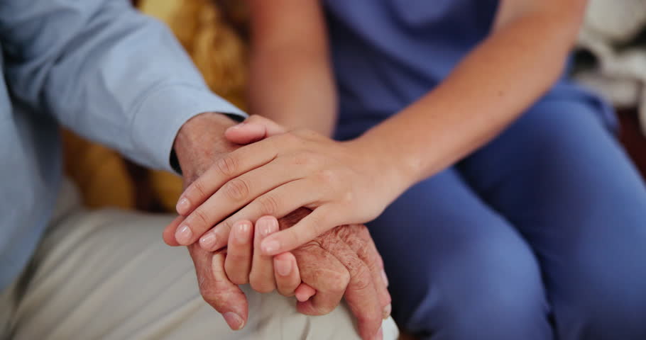 Senior care, empathy or closeup of nurse holding hands with person for healthcare, wellness or service. Support, love and caregiver helping for comfort or elderly patient for medical check or nursing
