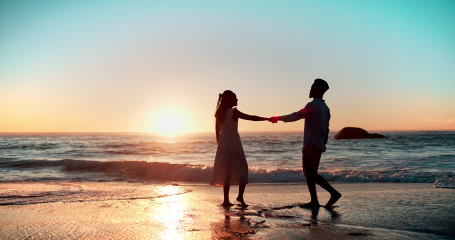 Beach, couple and sunset at ocean with running for adventure, love and summer date together with freedom. Man, woman and holding hands by water for holiday, romance and vacation weekend in Greece