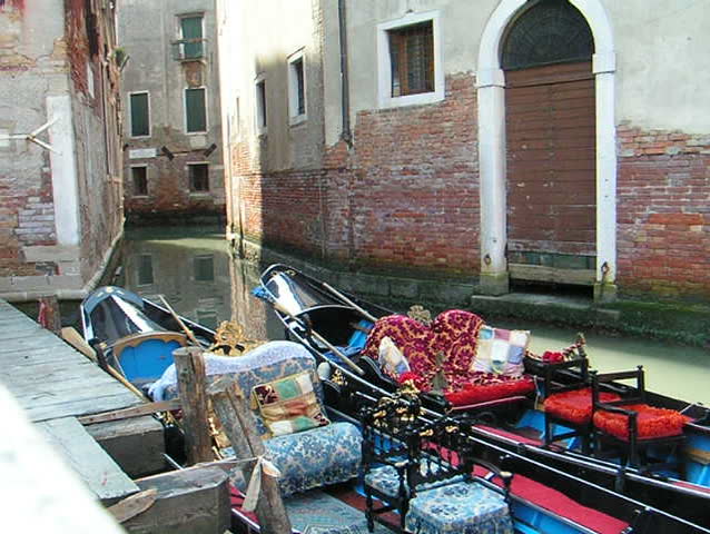 Venice: Waiting gongolas along an unknown canal