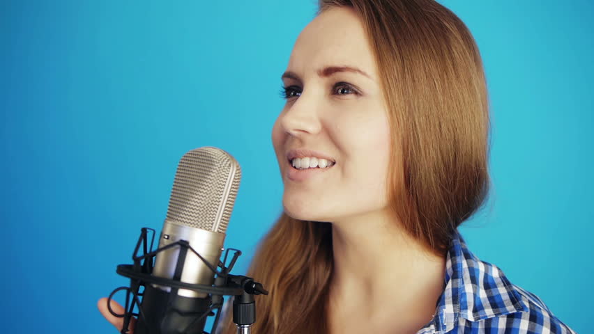 young woman singing at studio