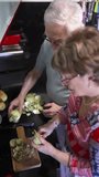 Retired couple preparing healthy food at home kitchen