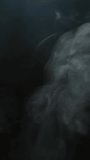vertical footage of smoke dark background