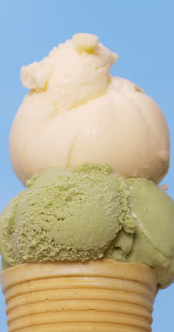 4K footage vertical video front view CU Spoon the chocolate chip ice cream over the vanilla and green tea ice cream. Royalty-Free Stock Footage #3453815245