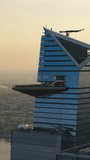 Vertical Screen: Fly-By Panorama Around the 30 Hudson Yards Skyscraper in New York City, USA. Aerial Footage with a Modern Skyscraper with Observation Balcony. Travelers Enjoy the Panoramic View