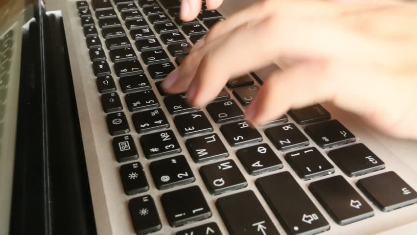 Close-up of a typing on a laptop keyboard (HD)
