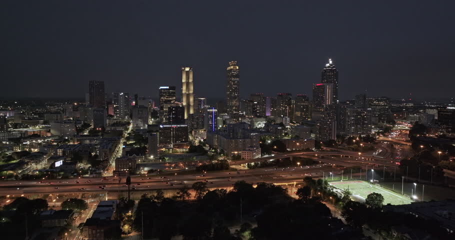 Atlanta Georgia Aerial v907 epic drone flyover Sweet Auburn capturing freeway traffic, downtown cityscape and flashing lightning strikes over the dark night sky - Shot with Mavic 3 Pro Cine - May 2023