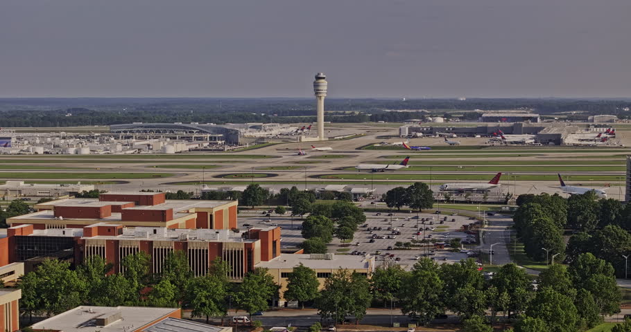 Atlanta Georgia Aerial v936 drone flyover Hapeville capturing International terminals at ATL Hartsfield airport with FAA air traffic control tower and Delta HQ - Shot with Mavic 3 Pro Cine - May 2023