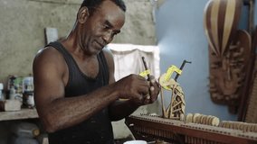 Old man luthier music artisan repairing wooden grand piano music instruments  - Powered by Shutterstock - Get 15% off with code: PIKWIZARD15
