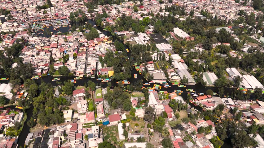 Flying over Xochimilco in the South of CDMX. Showing the Trajineras Road in Contrast with the City