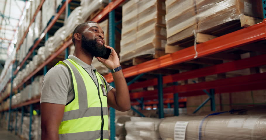 Black man, phone call and logistics with inventory for conversation, communication or discussion at warehouse. African male person or employee talking on mobile smartphone for supply chain at depot