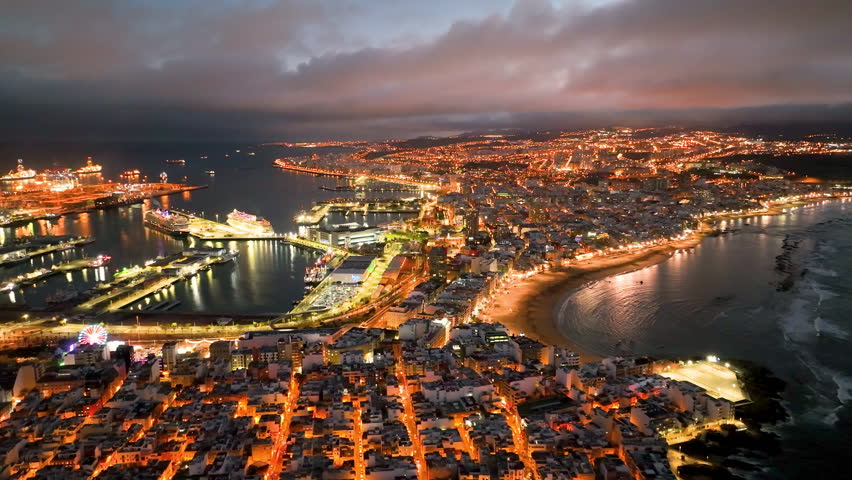 4k Aerial view of Las Palmas de Gran Canaria, the capital city of the Canary Islands. Spain. Playa de Las Canteras beach
