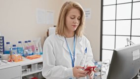 A happy young woman scientist using a smartphone in a laboratory setting. - Powered by Shutterstock - Get 15% off with code: PIKWIZARD15