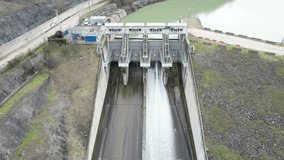 Hydroelectric power plant, river dam with flowing water, High quality 4k footage
