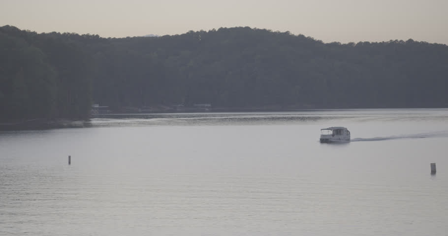 Pontoon moves slowly across calm water