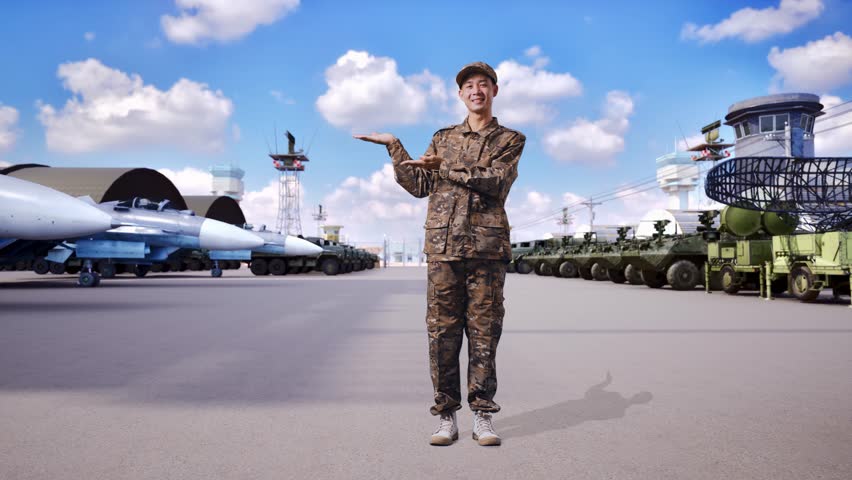 Full Body Of Asian Man Soldier Smiling And Pointing To Side While Standing At Military Camp
