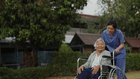 nurse take care and pushing senior woman in wheelchair at the park, friendly caregiver - Powered by Shutterstock - Get 15% off with code: PIKWIZARD15