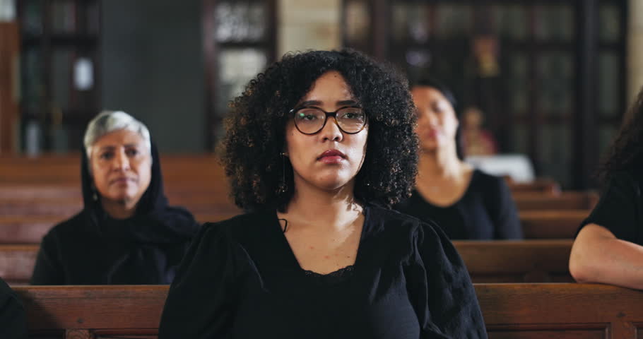 Funeral, service and people praying in church, memorial and ceremony in religion for death and mourning loss. Christian, crowd and sad congregation thinking of memory or respect prayer in chapel
