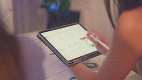 A detailed view of a digital tablet screen displaying ESG data and analytics during a sustainability-focused business meeting. - Powered by Shutterstock - Get 15% off with code: PIKWIZARD15