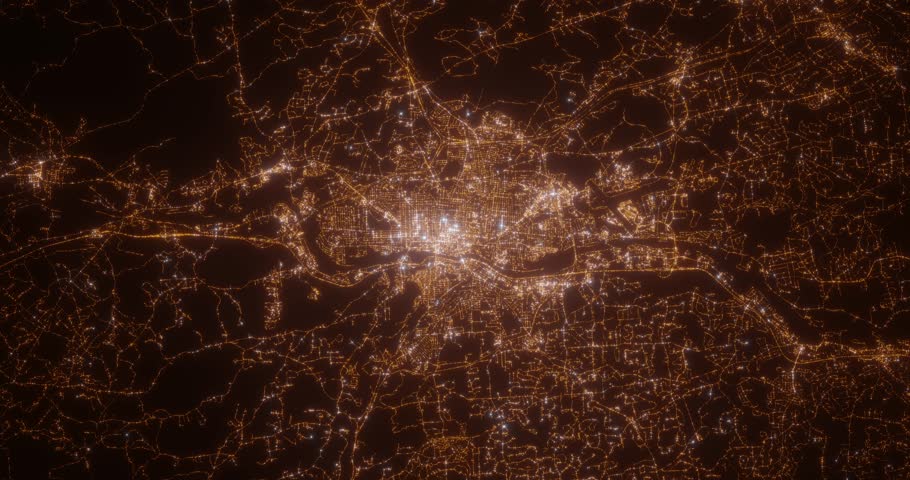 Manchester (New Hampshire, USA) aerial view at night. Top view on modern city with street lights. Camera is zooming out, rotating clockwise. Vertical video. The north is on the left side